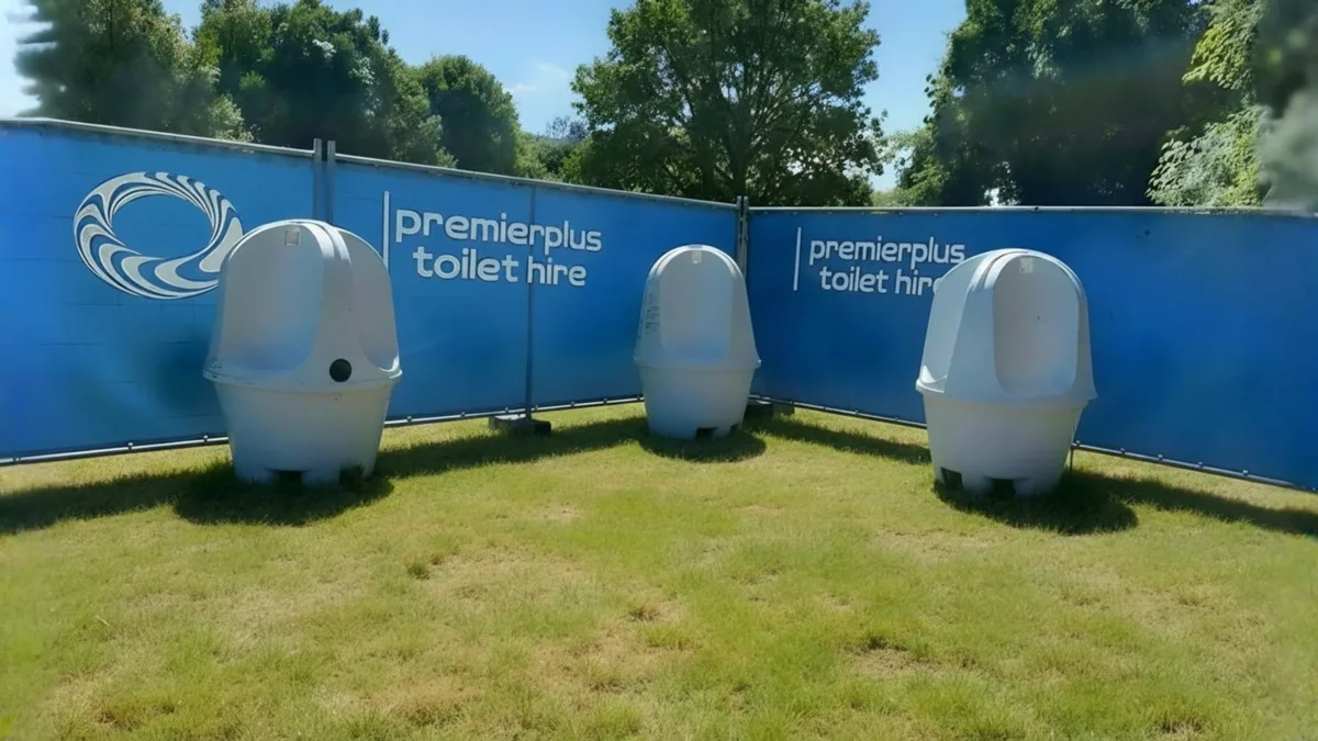 PremierPlus portable urinals set up on grass at an outdoor event