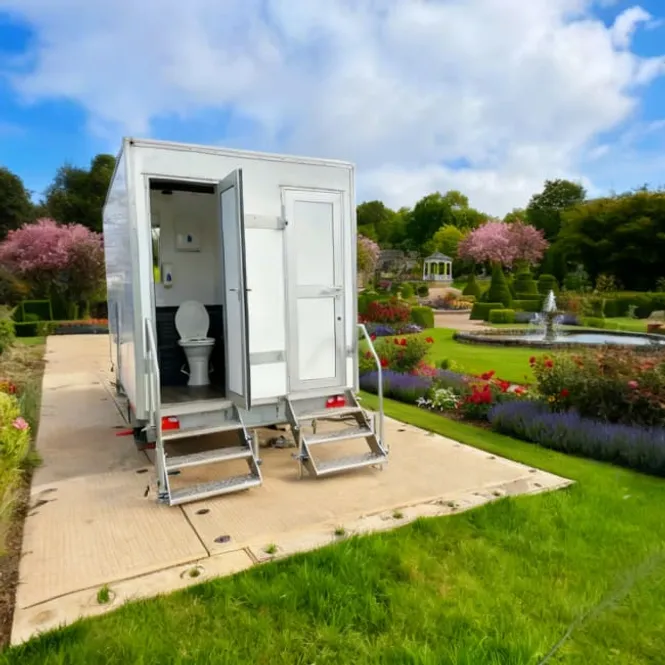 PremierPlus luxury toilet trailer at outdoor garden event