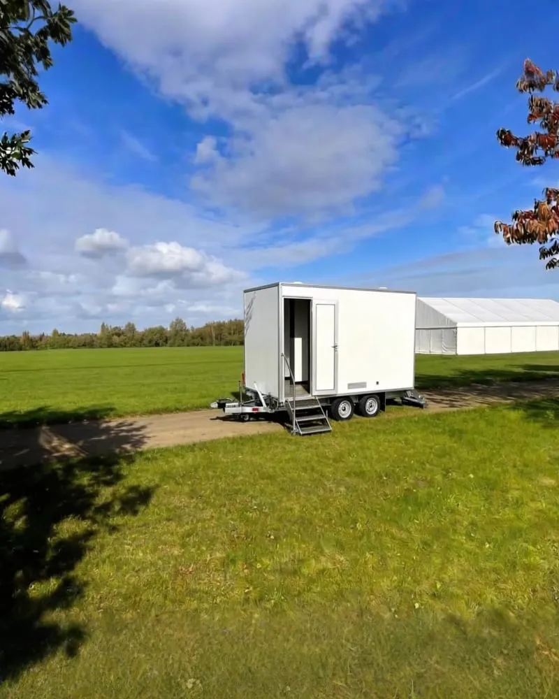 Luxury toilet trailer interior with walnut doors and mirrors